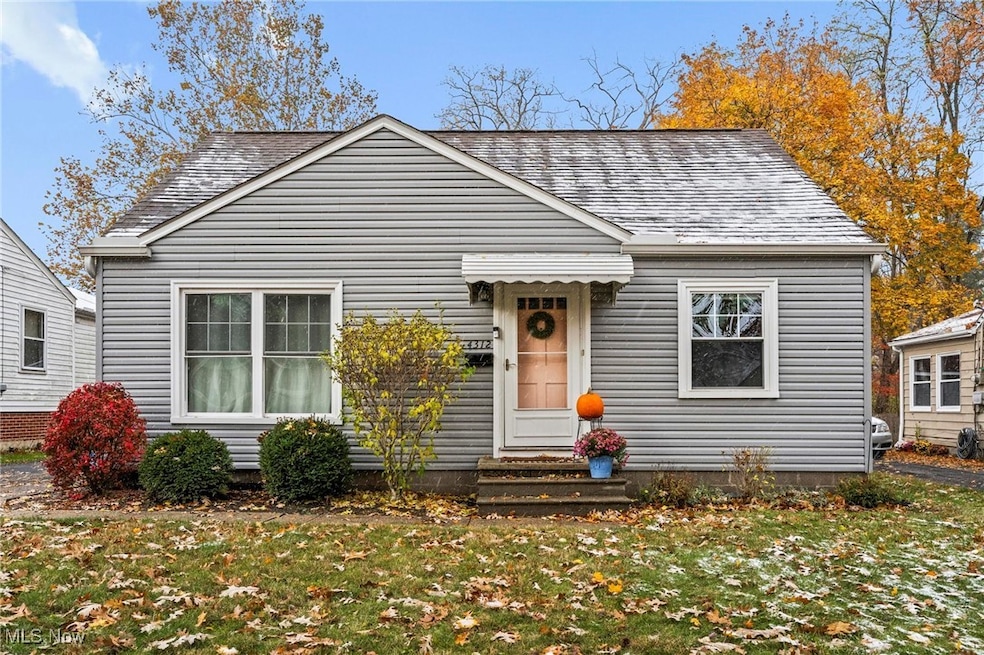 Bungalow-style home with a front lawn