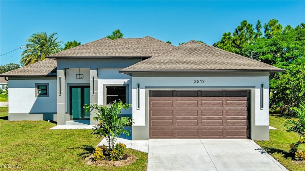 View of front of home with a shingled roof, a front lawn, stucco siding, and a garage