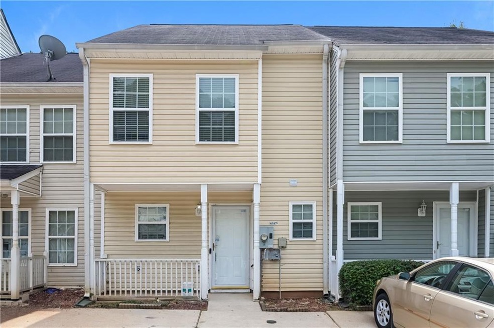 View of front facade with roof with shingles