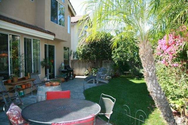 Backyard with grass and dining area