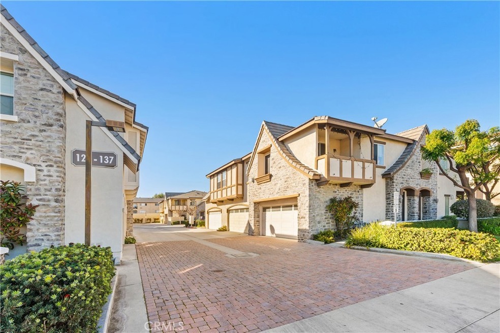 Enchanting French Tudor Style townhome is move-in ready, centrally located, and has a private end unit location.
