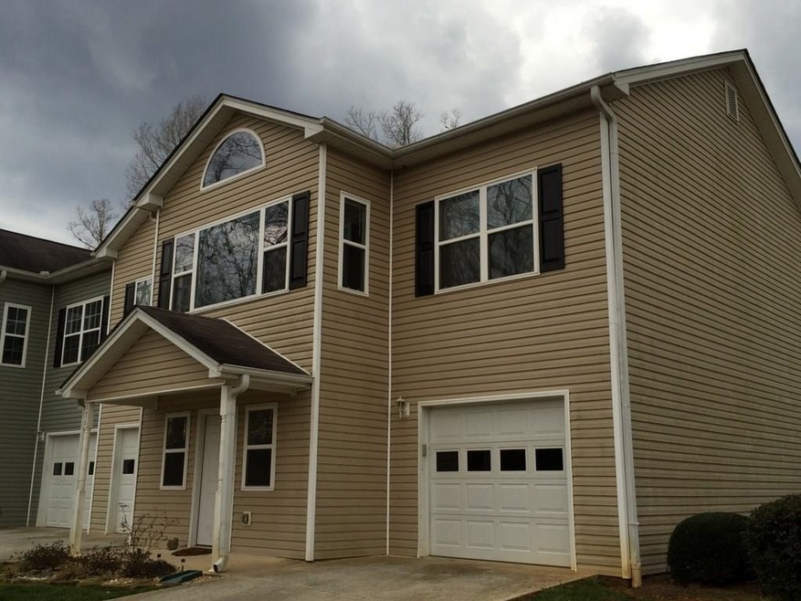 This is a end unit. View from upstairs is wooded.