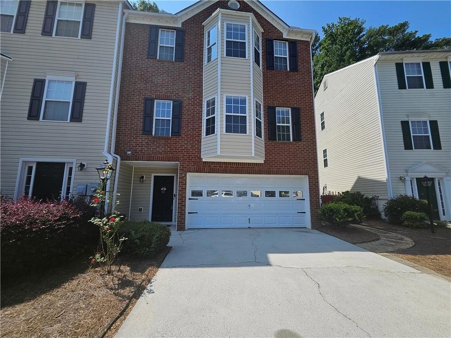 View of property featuring a garage