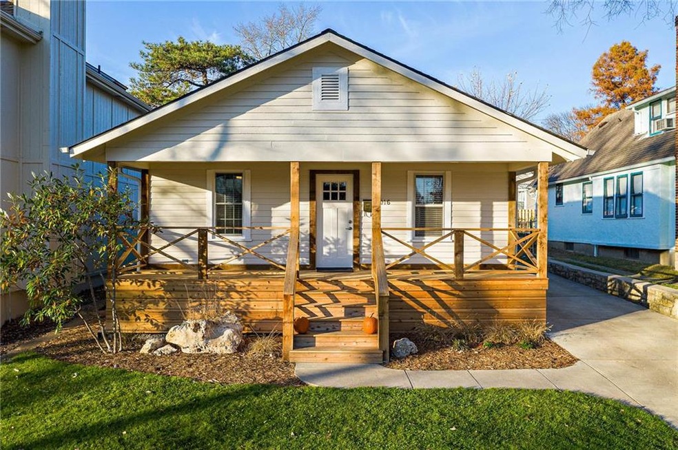 This charming, 100-year-old bungalow greets you wi