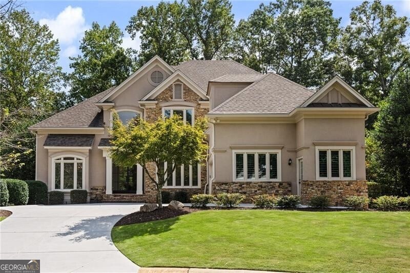 Craftsman-style house with a front lawn