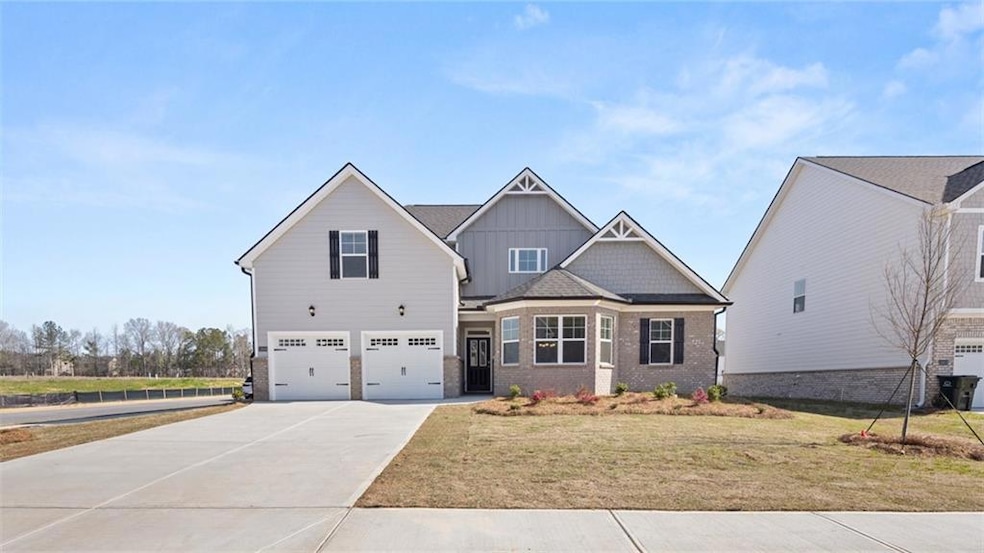 Craftsman house with brick siding, board and batte