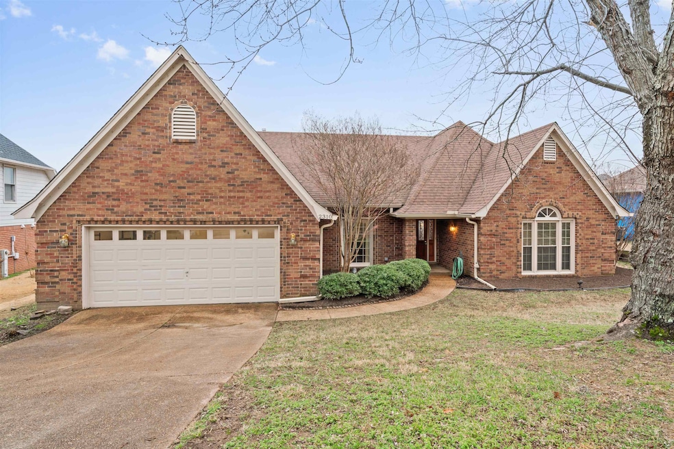 View of front of property featuring a garage and a