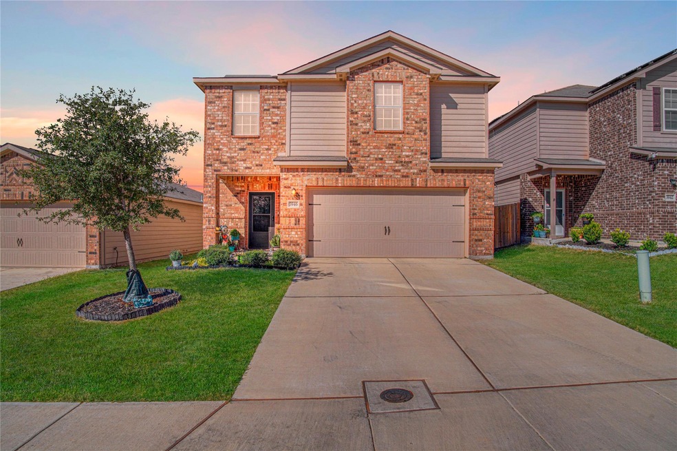 Traditional-style home featuring brick siding, dr