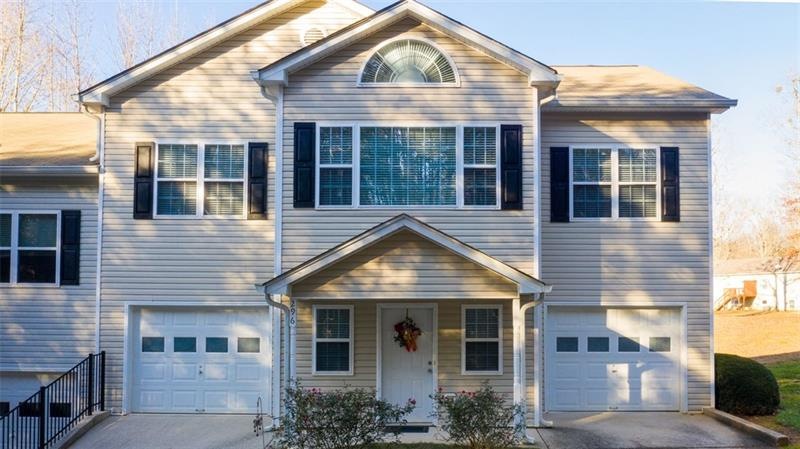 Spacious townhome with split 2 car garage.