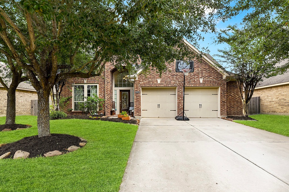 Welcome home to 29018 Davenport Drive! Nestled within the master-planned community of Firethorne, this stunning home offers a wealth of amenities and charm.