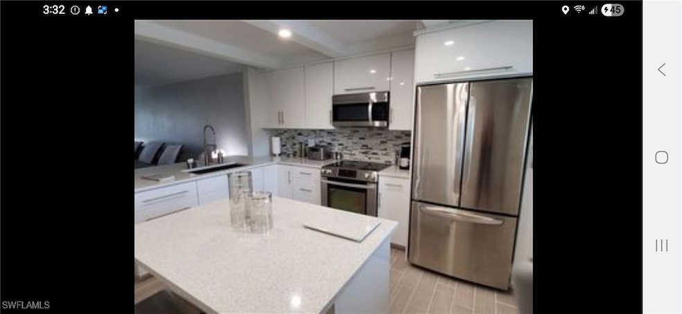 Kitchen featuring appliances with stainless steel