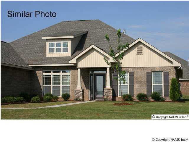 Full brick with stacked stone columns (similar home)