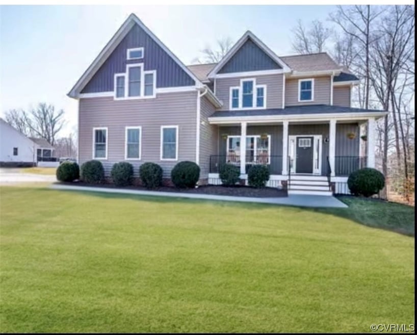 View of front of property featuring a front yard a