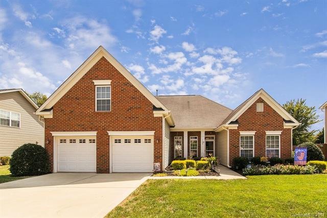 Gorgeous exterior home with professional landscapi