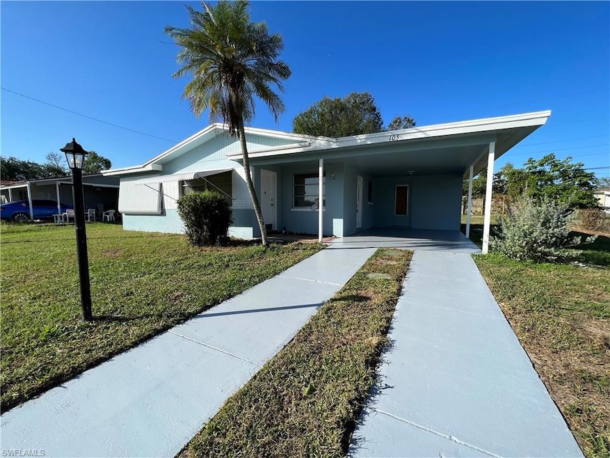 View of front of home featuring a carport and a fr
