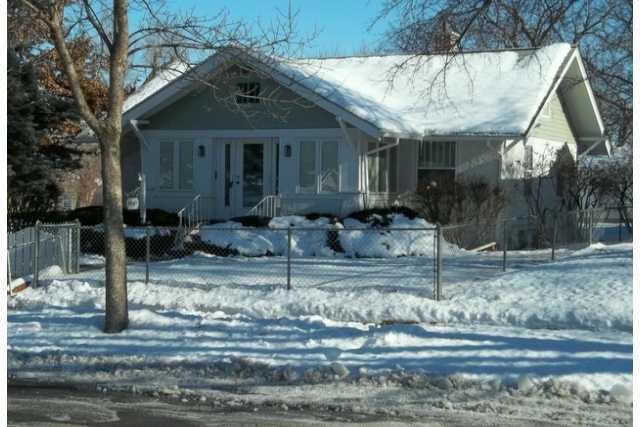 Exterior Front. Yard completely fenced.  Lots of p
