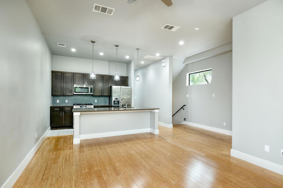 Kitchen featuring stainless steel appliances, dar