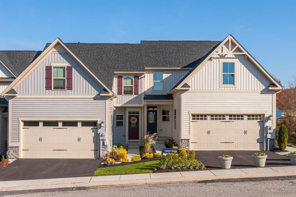 Welcome Home!! A rare find! A 2 car garage townhome with the owners bedroom on the 1st floor!