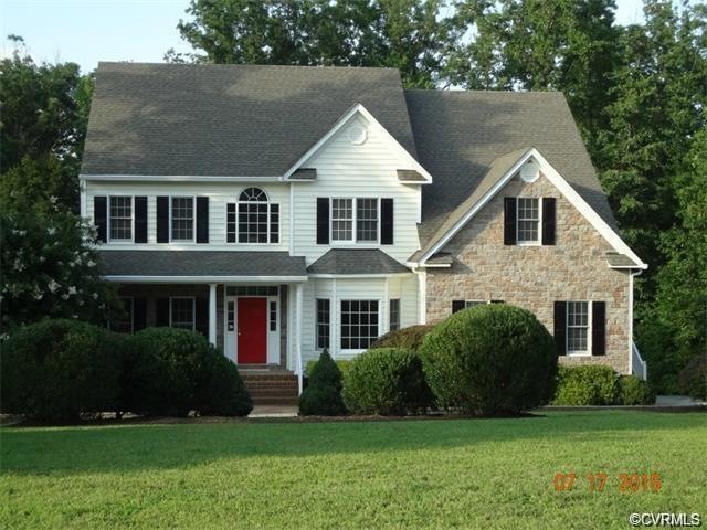 Exterior front showing stone and vinyl siding and 