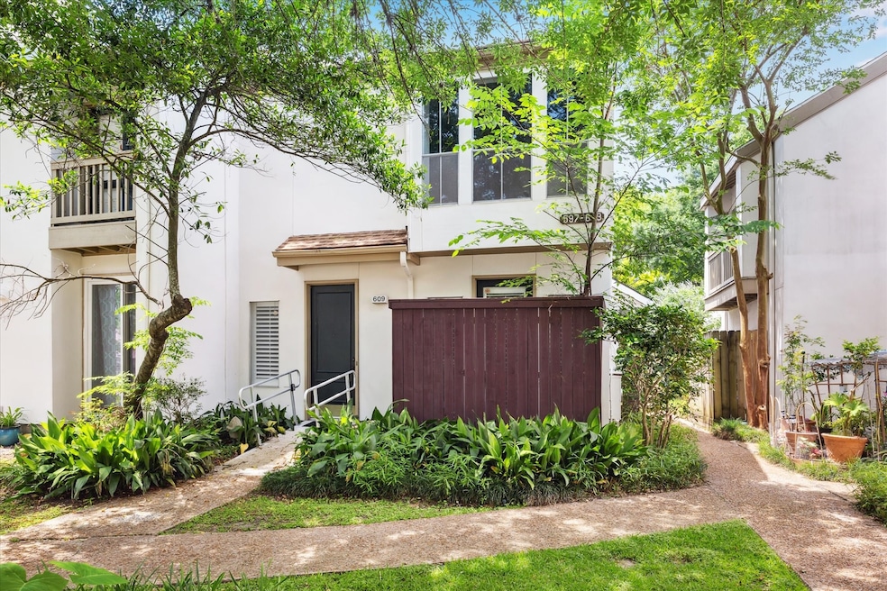 Front of home - Corner unit with lush foliage in f