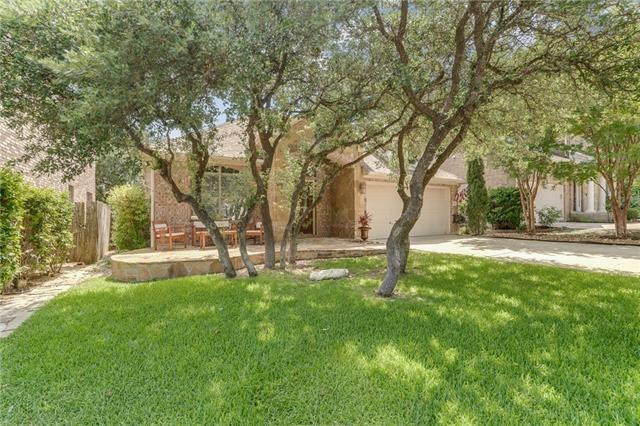 Charming, mostly one-story home that backs to a gr