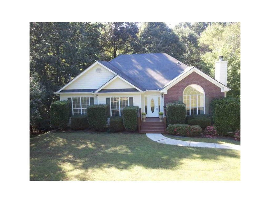 Exterior Front. Privacy abounds on this huge lot. 