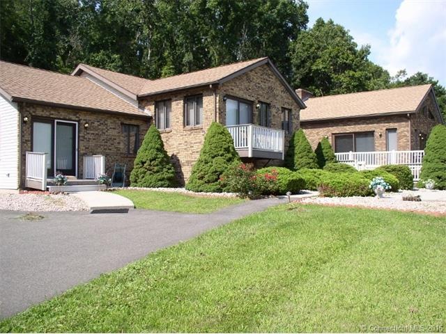 Front view of property showing in-law w/ private e