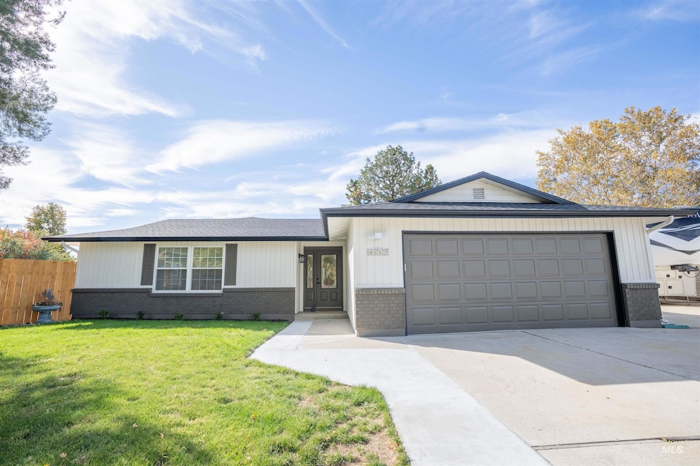 Ranch-style home with brick siding, driveway, a shingled roof, and an attached garage