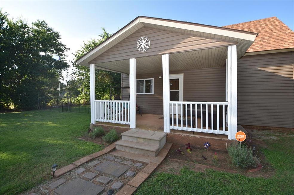 Property entrance featuring covered porch and a la