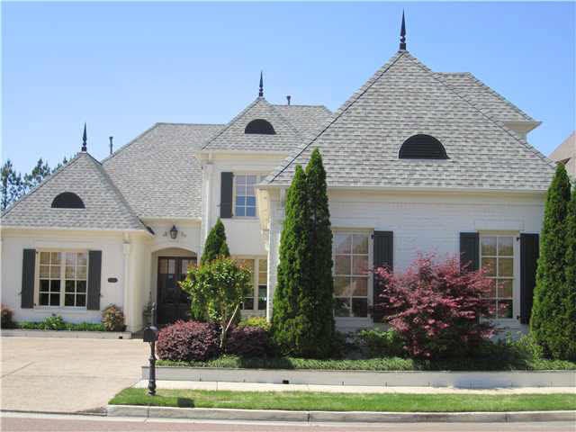 Charming french country home with painted brick.