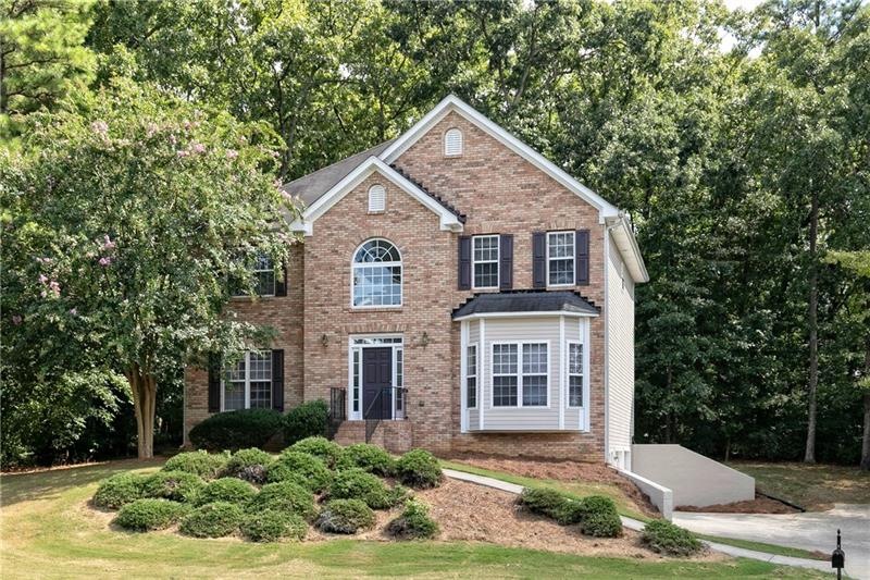 GORGEOUS THREE STORY HOME WITH LOVELY LAWN