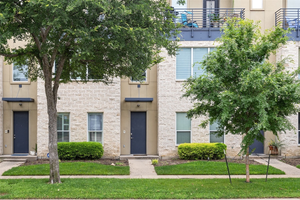 View of front of home featuring stone siding and stucco siding