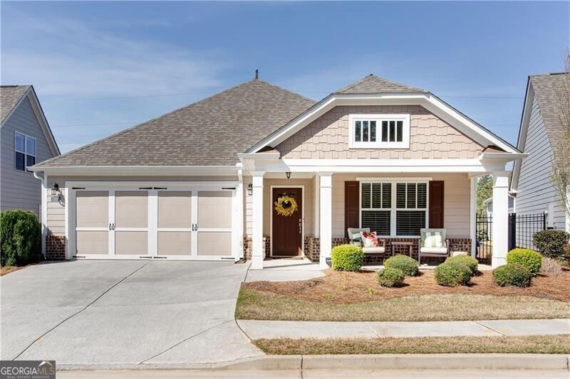 View of front of house featuring covered porch and