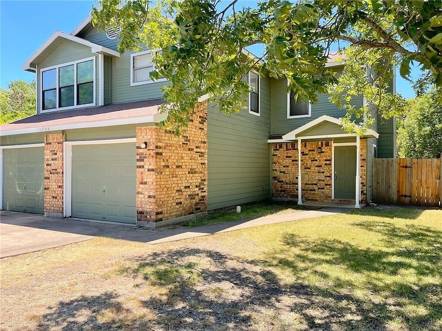 View of front of house featuring brick siding, an