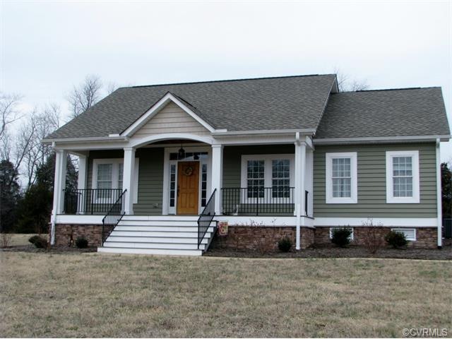 Beautiful Craftsman Style home with stone veneer foundation, front porch with black powder coated aluminum rails and a gorgeous front door with transom and side lights.  Sit on the front porch and enjoy your pond view.