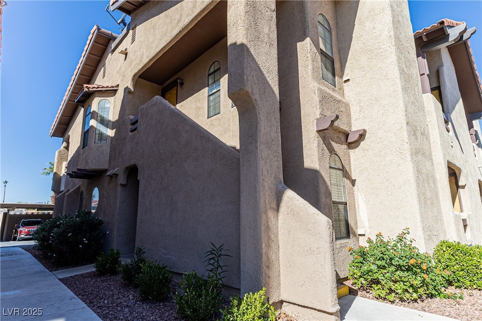 View of side of home featuring stucco siding and a tiled​​‌​​​​‌​​‌‌​​​‌​‌​​​‌‌​​​‌‌​​​​​​‌‌​‌‌‌ roof