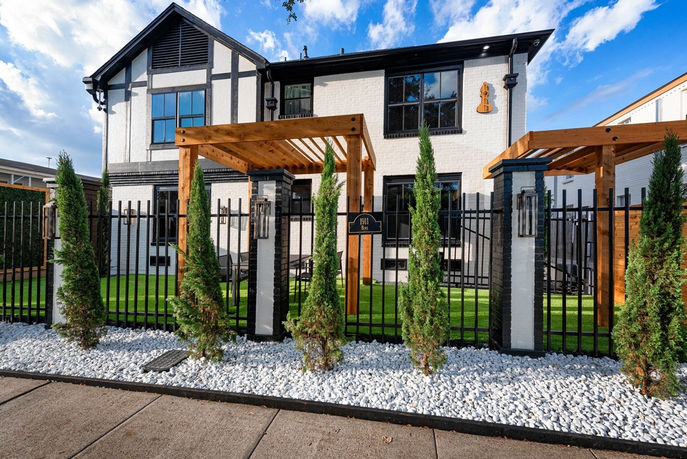 A beautifully renovated, brick colonial fourplex l