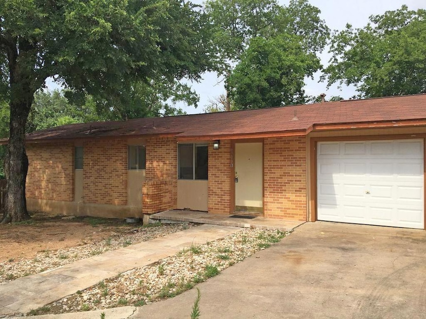 Ranch-style home featuring an attached garage, br