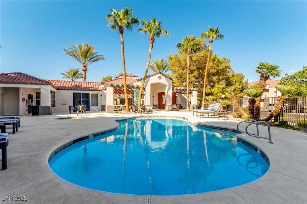 Community pool with a patio area