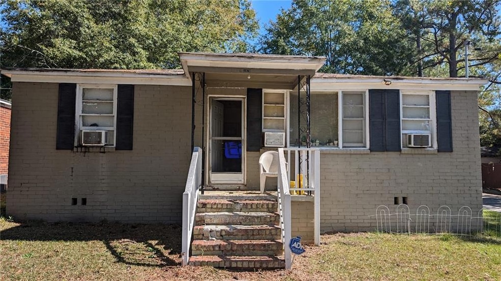 View of front of house with a front yard and cooli