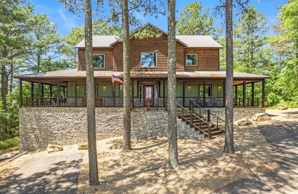 Rear view of property with covered porch