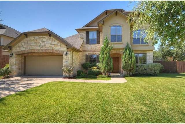 Stone & stucco home located on a corner lot in a b
