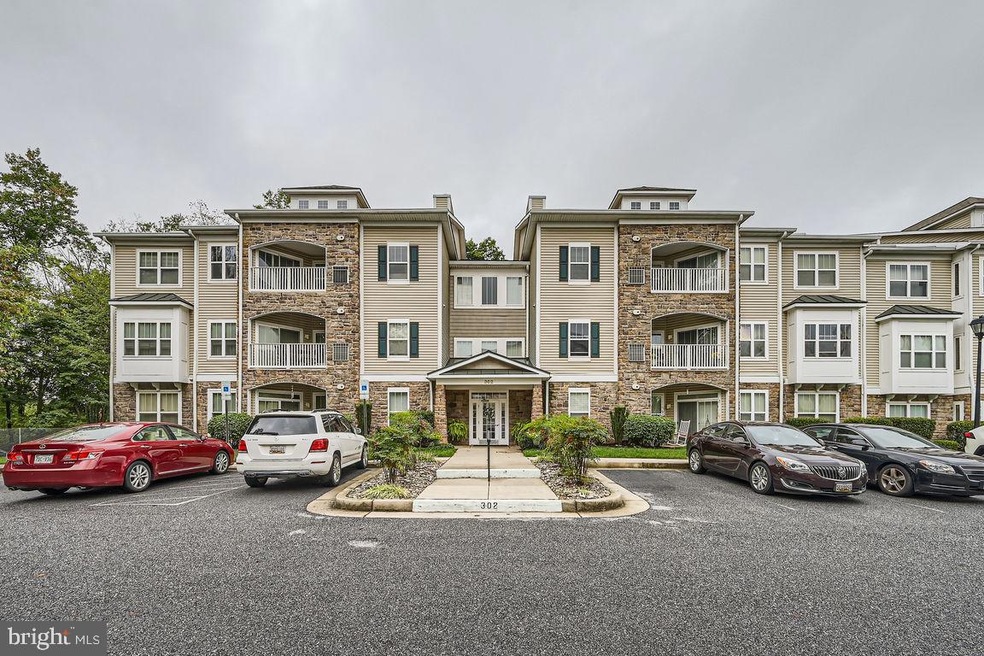 302 Wyndham Cir unit 302J, Owings Mills, MD 21117 - photo 1