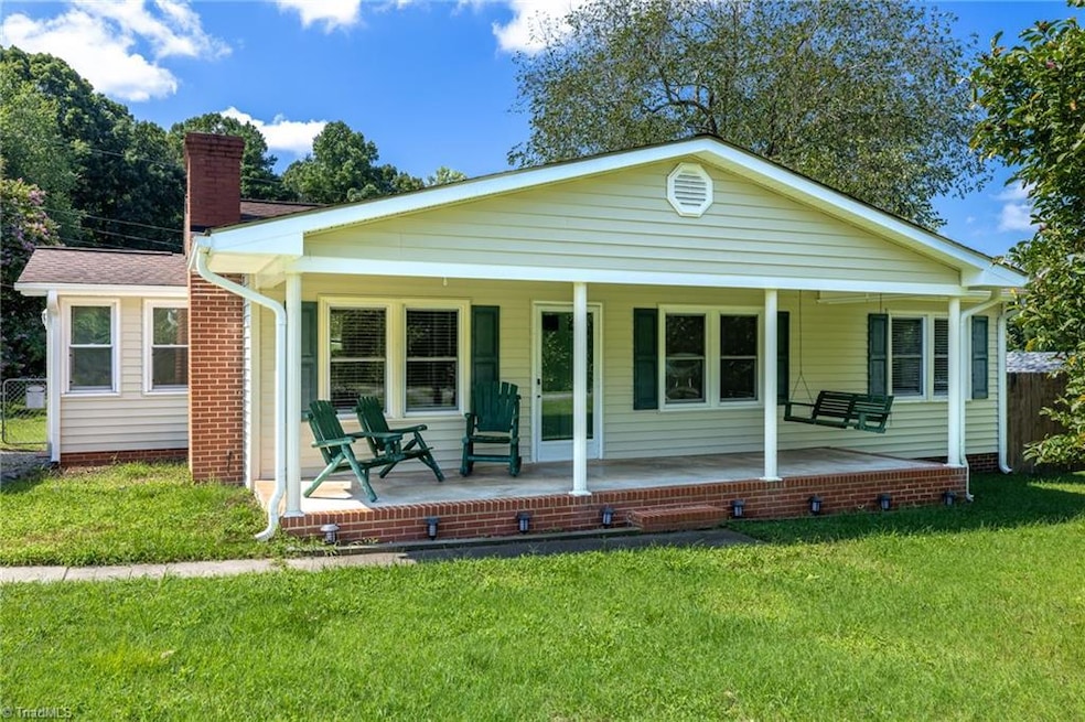 Visualization and feeling are key to a successful Home Buying experience. As you look at these pictures, imagine how great it will be LIVING HERE, thinking 'It's so good to be HOME’. It feels like HOME when you can picture yourself living here in every room. Here we have a Front View where you can see the covered front porch, the green grass and mature trees in the backyard, the sidewalk up to the front porch. A gravel driveway is to the left side with a 2-car detached carport.