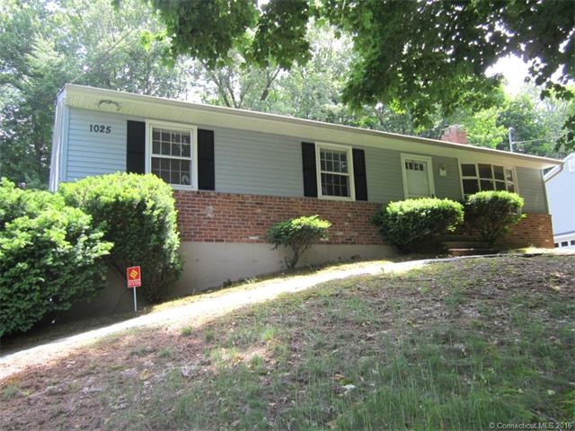 Four bedroom ranch in a neighborhood.