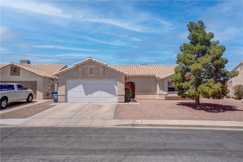 View of front of property with a garage, concrete