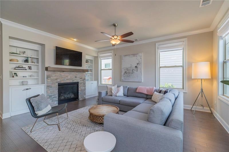 Family room features built in bookshelves, stacked