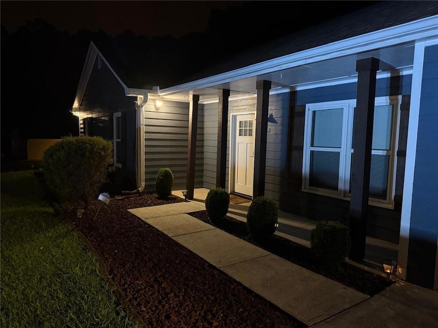View of exterior entry at twilight