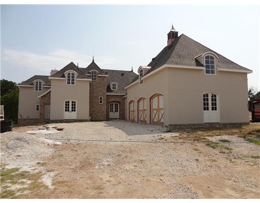 Exterior Front. Circular Driveway, workbench & was