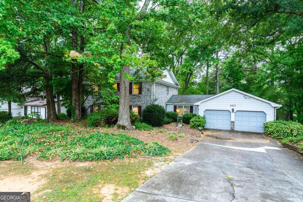 1417 Manchester Ct SW, Lilburn, GA 30047 - photo 1